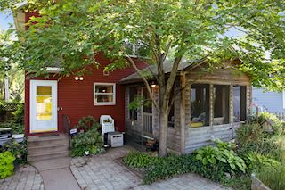 Beautiful screened porch and landscaped back yard
