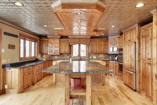 A large eating or working island is a perfect place for the family to gather for that big breakfast. The cabinet detailing is un-surpassed - paneled ends, paneled appliance fronts, special corner detailing and the custom built wood island soffit make this one a showstopper.