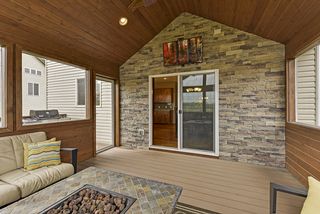 stacked stone accent wall with the ability to watch tv outside