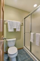 Separate toilet and shower in the private master bathroom
