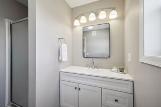 Primary Bath with newer vanity, lights and mirror.