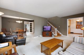 Living room, open to dining room on the left and eat in portion of kitchen on the right