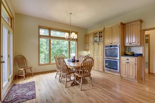The informal dining has a built-in desk area and walks out to the deck
