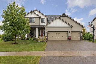 Wide driveway, sharp landscaping, beautiful porch