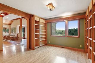 Main level den opens to living & dining room 