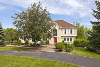 Inviting circle drive and gorgeous mature landscaping frame this Dellwood beauty!
