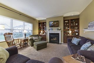 Welcoming living room with fireplace and builtins