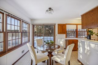 Kitchen leads to the expansive deck and beautiful backyard.
