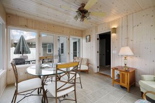 Back porch, door on right leads to dining room. french doors on left lead to the deck