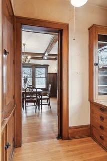 pantry with loads of storage between dining room and kitchen