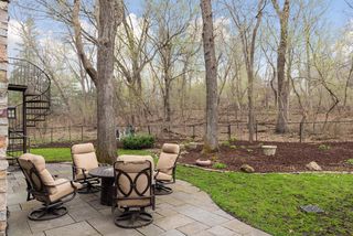 An artistic spiral staircase descends to the backyard