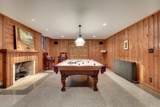 The Lower Level Billiard Room features restored Terrazzo Floors & Wood Walls...