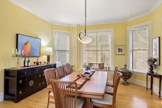 Large windows and tall ceilings offer an expansive Dining Room for family and holiday entertaining
