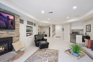 Fieldstone fireplace and wet bar with newer frig