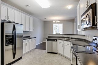Kitchen with stainless appliances and full pantry...