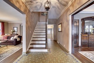 The Entry Foyer & Hallway feature original Hand Made Tile.