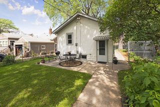 Sidewalks surround this very well cared for home.