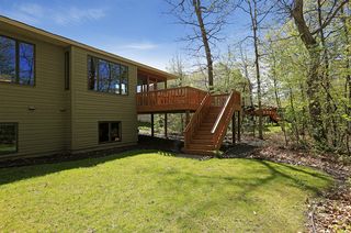 Easy access to yard from screen porch and decks above