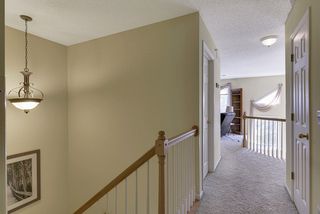 Upper hall leading to loft overlooking living room
