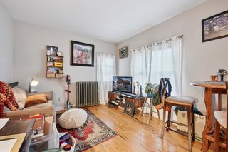 View of Living room in Apt #2.
Features all new vinyl windows, hardwood floors & closet.