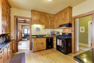 4351 Aldrich kitchen with original wood cabinetry, updated appliances and granite countertops