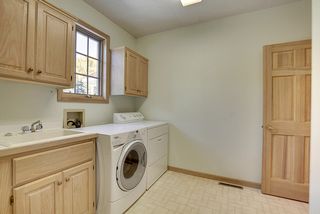 Large working Laundry off the Garage. Laundry sink and cabinet space galore.