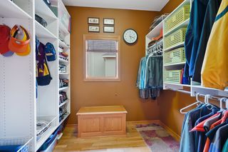 Oversized mudroom closet with built-ins.