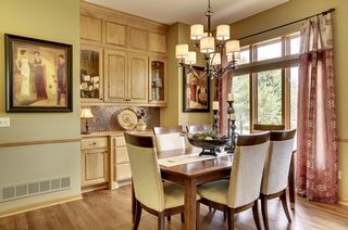 Formal dining with hardwood floors, chair railing and built in