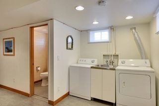 The Laundry Room features a Stainless Steel Sink & Recessed Lights! 
