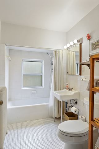 Second floor full hall bath that completes the possible rental unit