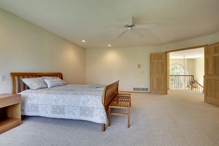 Double doors lead to this Master Bedroom space off the 2 story Entry Foyer.