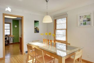 The Dining Room features Hardwood Floors & beautiful Pendant Light Fixture...