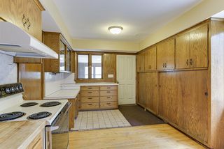 Standing in kitchen looking toward backdoor that leads to the mudroom