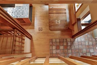 Custom banquette features coordinating inlays
