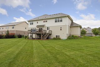 Well manicured lawn with sprinkler system to keep it looking green all summer.