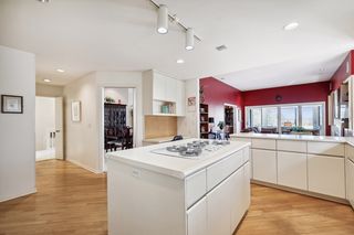 Kitchen showing views into dining room, dinette and family room as well a the 3 season porch.