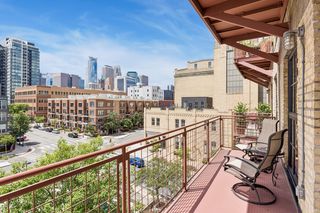 Private balcony with city skyline views.