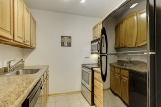 The "Galley Style" Kitchen features Stainless Steel & Black Appliances...