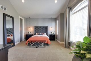 Elegant master suite with double walk-in closets...