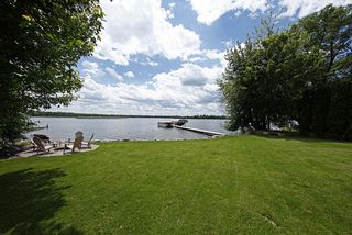 Beautifully landscaped, fully irrigated yard area with lakeside fire pit.