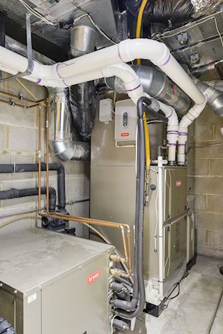 Geothermal heating system is zoned by floor 