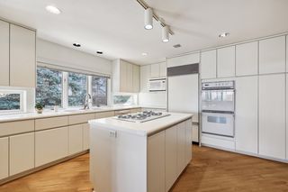 Large  convenient pantry wall.  Beautiful wood flooring installed on the diagonal.