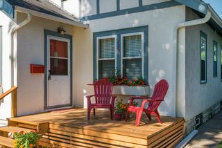 Blue trim with red accents updates this home's presence. 