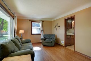 Gleaming hardwood floors and sunlit rooms welcome you home