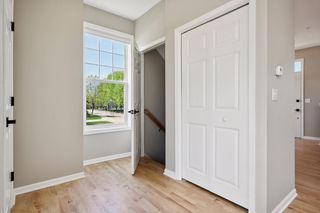 Access to lower level and a coat closet - 1/2 bath is to the left of photo.