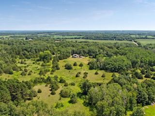 Mature trees surround this property