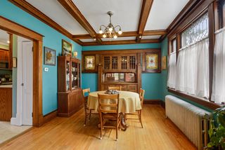 Dining room with built-ins, coffered ceiling and leaded glass windows