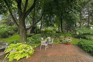 The Private, Wooded Lot is surrounded by mature Perennial Gardens.... Don't miss the Custom Garden Shed too! 