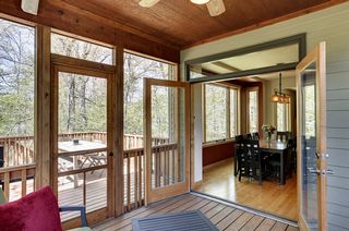 Double door access to porch with cedar wood ceilings