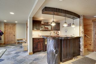 The bar is detailed above and beyond the typical bar - a special cut trunk piece holds the unique top in place as the bar surface.